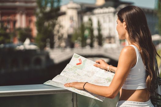 Young caucasian woman doing errands around the city, shopping at the market, going for lunch, walking around the city and enjoying a beautiful sunny day.