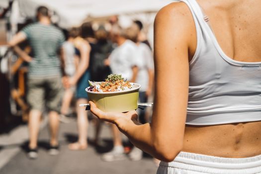 Young caucasian woman doing errands around the city, shopping at the market, going for lunch, walking around the city and enjoying a beautiful sunny day.