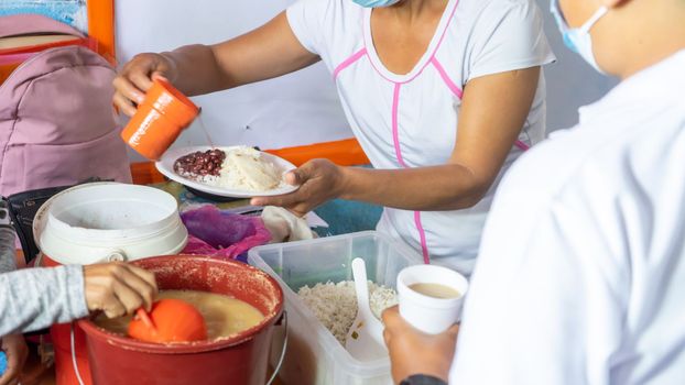 School snack for Latin American students. Unrecognizable people