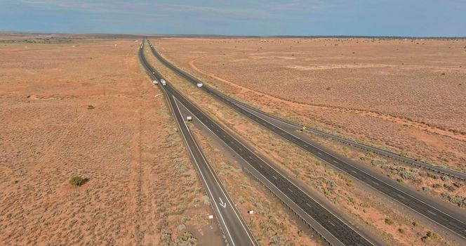 This is panoramic view of an American highway located west in desert environment near San Jon in New Mexico, USA.