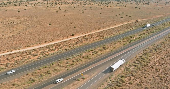 This is panorama of highway in America that is located an desert environment near San Jon United States of America.