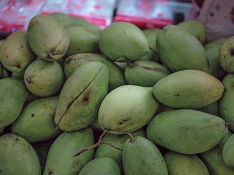 Green mangoes on  Thai market .