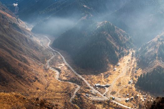Top view of Almaty gorge and the bear gorge or ayusai with visit center for tourists. Almaty, Kazakhstan - October 25, 2022
