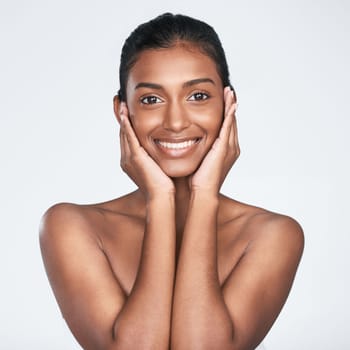 A good beauty regime will give you great results. a beautiful young woman posing against a white background