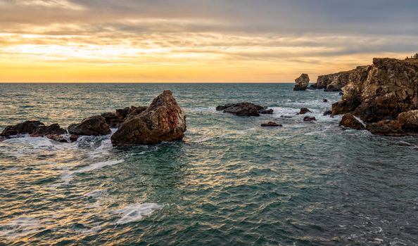 Beautiful cliffs of the Black sea. Rocks among the sea waves.