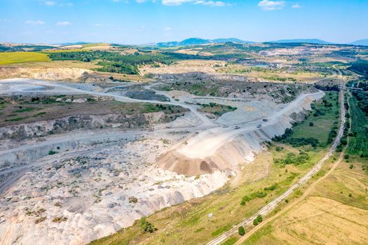 Aerial drone view flight over a quarry. Mining industry.