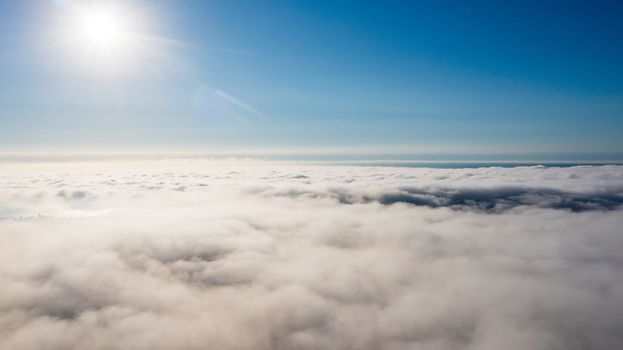 Sun over city fog, view from above