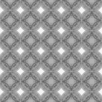 Ikat repeating swimwear design. Black and white magnetic boho chic summer design. Textile ready ideal print, swimwear fabric, wallpaper, wrapping. Watercolor ikat repeating tile border.