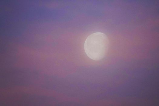 Waning gibbous moon at dawn. Glorious pink-blue sky