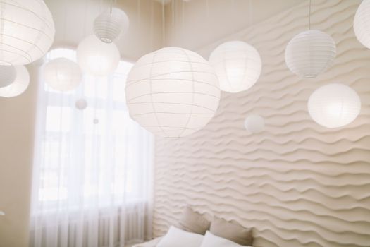 White bedroom interior. Stylish interior of contemporary room with comfortable bed.