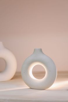 Nordic design ceramic vase. modern original designer flower vase isolated on beige background.