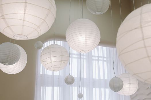 Beige paper lamps in modern interior. cozy home interior.