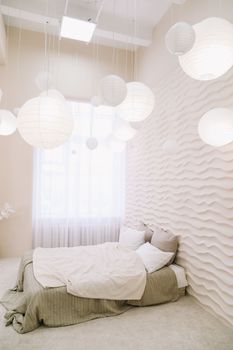 White bedroom interior. Stylish interior of contemporary room with comfortable bed.