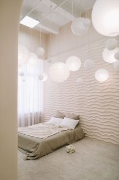 White bedroom interior. Stylish interior of contemporary room with comfortable bed.