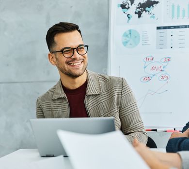 Group of young business people having a meeting or presentation and seminar with whiteboard in the office. Portrait of a young businessman talking