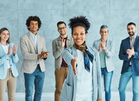 Group of young and senior business people having a meeting shaking hands handshake introducing each other in the office. Teamwork and success concept