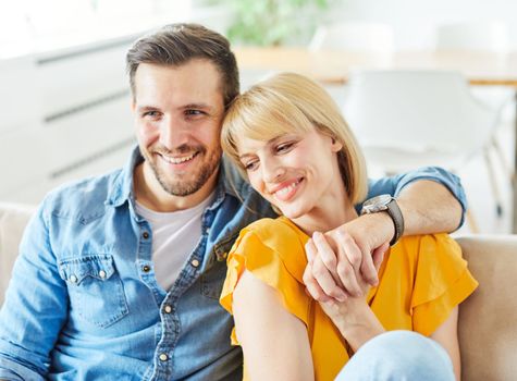 Portrait of a lovely young couple together at home