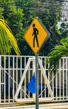 Yellow pedestrian sign street sign in Playa del Carmen Quintana Roo Mexico.