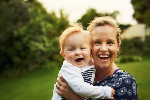 Mommy dearest. an adorable little boy and his mother playing in the backyard