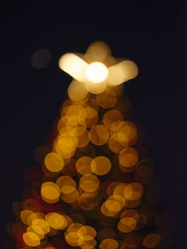 Blur light celebration on christmas tree with bokeh background