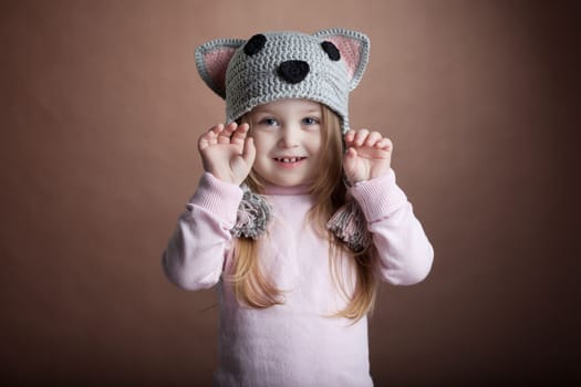 Studio portrait of cute little girl in cat costume