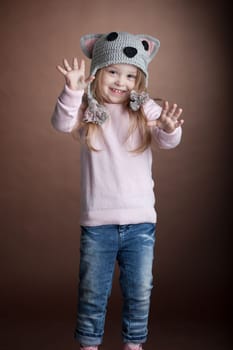 Studio portrait of little girl in cat costume