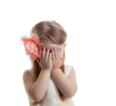 Pretty little girl crying. Isolated on white