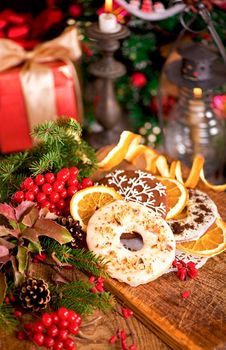 Christmas decoration with cookies and spices on an old wooden background.