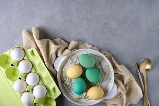 Easter composition with chicken and cardboard container for eggs. Copy space.