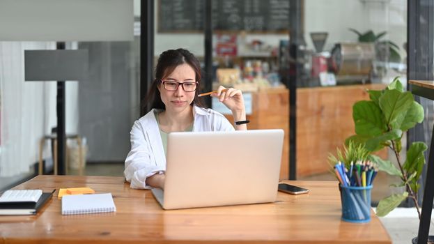 Successful businesswoman working with laptop computer.