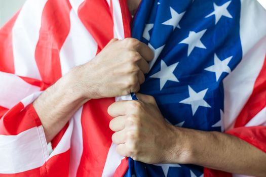male hands on usa flag.