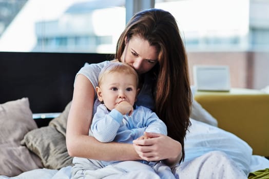 Moments in motherhood. a mother and her baby boy at home