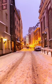 Illuminated street in the city. Christmas decorations in the old town Riga, Latvia.