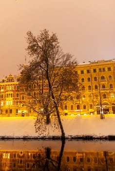 Illuminated street in the city. Christmas decorations in the old town Riga, Latvia.