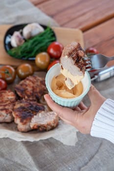 Fried pork shashlik with vegetables and sauce. Summer holiday concept