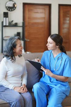 Portrait of a female doctor holding a patient clipboard to discuss and analyze the patient's condition before treating