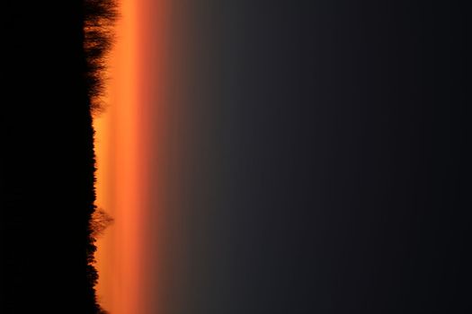 Real amazing panoramic sunrise or sunset sky with colorful clouds. Gradient color. Sky texture, abstract nature background.