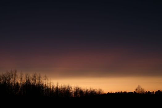 Real amazing panoramic sunrise or sunset sky with colorful clouds. Gradient color. Sky texture, abstract nature background.