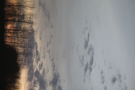 Real amazing panoramic sunrise or sunset sky with colorful clouds. Gradient color. Sky texture, abstract nature background.