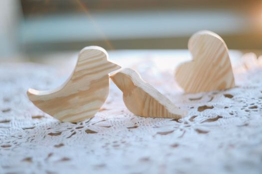 pair of wooden carved handmade toy birds. Eco-friendly wooden educational toys based on the Montessori method. Wooden toys, handmade toys for kindergarten