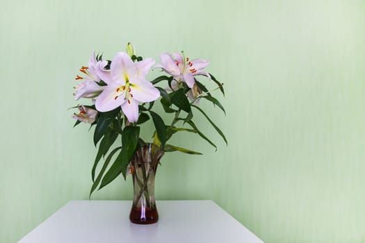 Beautiful white lily flowers in a bouquet. Elegant floral decor.