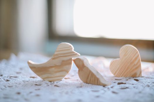 pair of wooden carved handmade toy birds. Eco-friendly wooden educational toys based on the Montessori method. Wooden toys, handmade toys for kindergarten