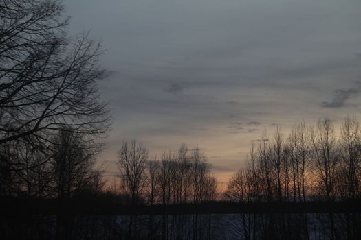 Real amazing panoramic sunrise or sunset sky with colorful clouds. Gradient color. Sky texture, abstract nature background.