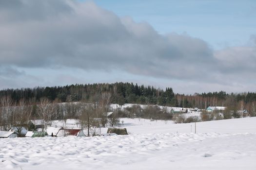 Rural beautiful winter landscape. Non-urban scene. New Year, Christmas. Copy space. Picturesque view of countryside on a frosty winter day