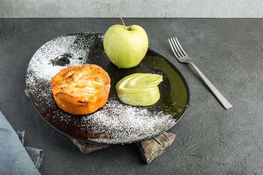 A sweet and fragrant apple pie on the table with copyspace for text.