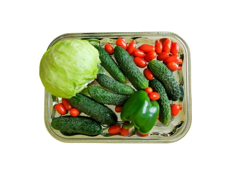 Fresh vegetables on the tray. Cabbage, cherry tomatoes and cucumbers.