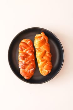 Freshly baked sweet buns. Homemade pastry on white background.