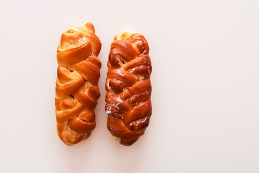 Freshly baked sweet buns. Homemade pastry on white background.