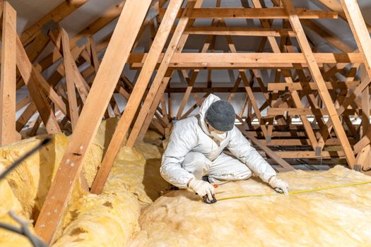 insulation of the roof and ceiling with glass wool.