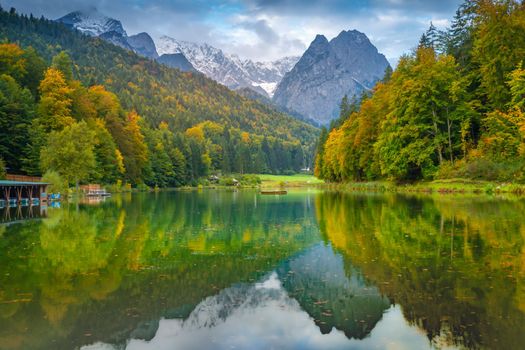 Riessersee alpine turquoise lake reflection at sunrise, Garmisch, Bavarian alps, Germany